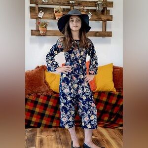 SMUKKE FLORAL PRINT NAVY SMOCKED & RUFFLE DETAILS, TIE SHOULDERS, JUMPSUIT